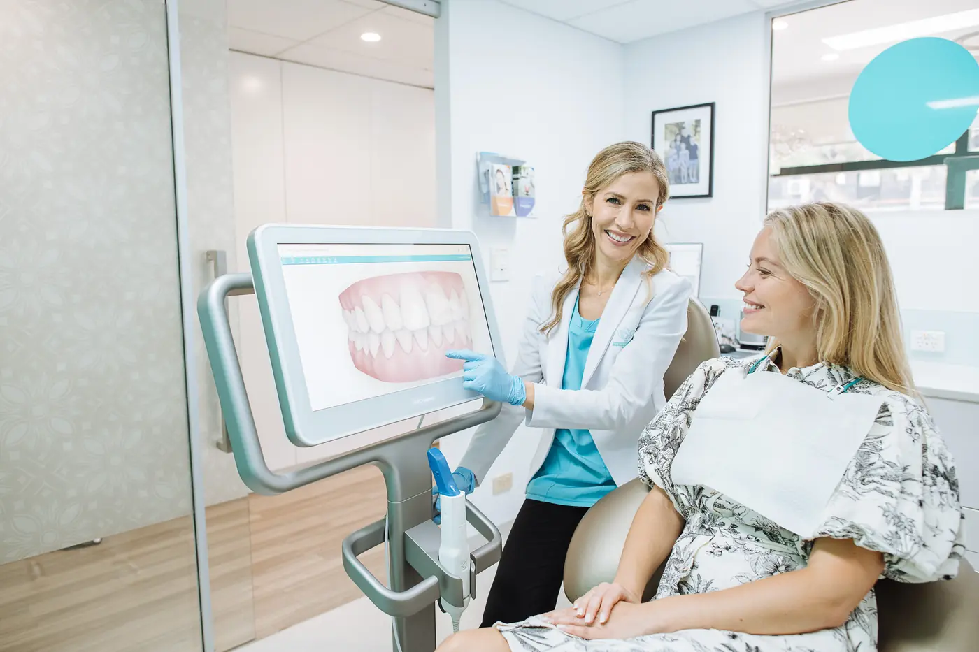 Dr Ellie Montero showing a patient a digital scan of her teeth